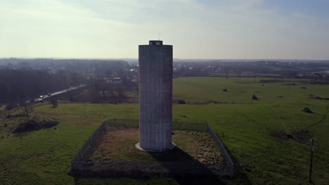 aerial establishing shot of clarinbridge water tower, featuring pleasant sun flares as sunlight highlights the structure.