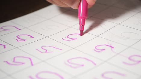 child practicing number tracing