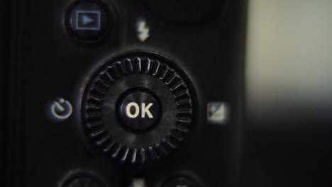 macro shot of a dslr camera, menu buttons close up, studio lighting, photography gear, slow motion 120 fps, full hd video, slide right movement