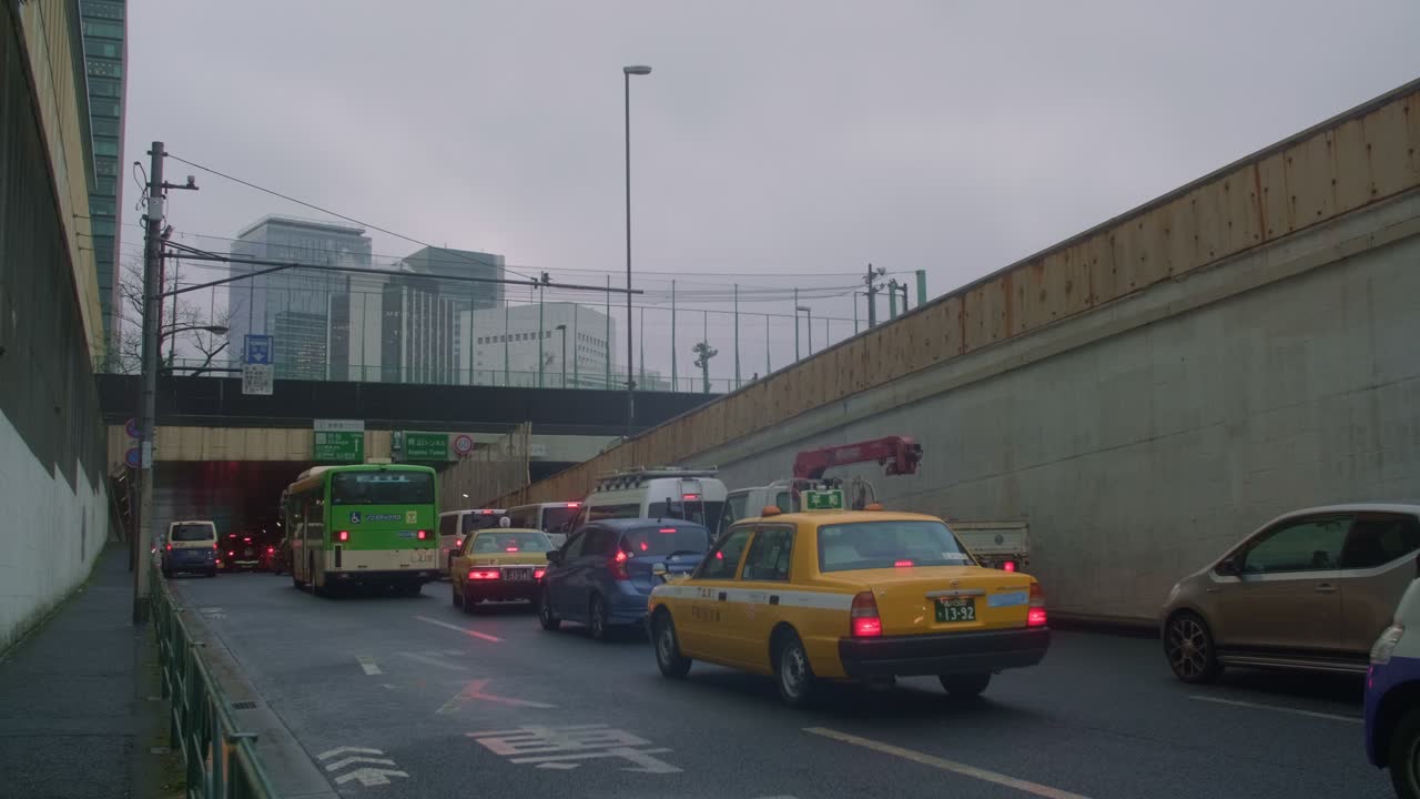 Tokyo Street Lights: Evening Urban Scene Capture the vibrant energy of Tokyo's bustling streets, illuminated by neon lights as evening sets in.