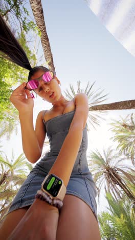 playful summer portrait under palm trees