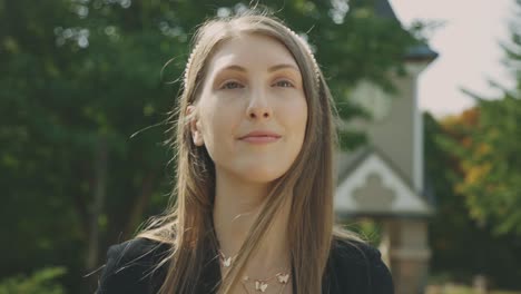 Attractive-Female-Model-Wearing-A-Pearl-Beaded-Headband-Posing-In-Front-Of-Camera---Rack-Focus-Slow-Motion