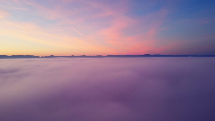Amazing view over clouds at sunset
