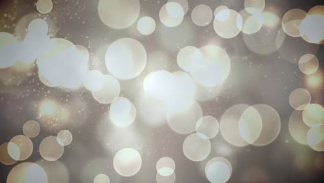 animation of glowing white bokeh christmas lights over smoke on night sky