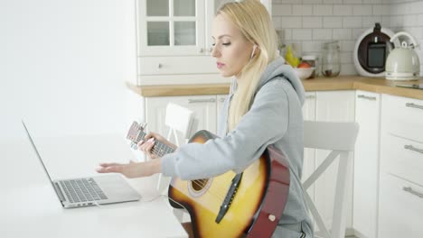 woman playing electric guitar