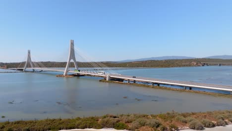 Suspension-bridge-spanning-river-and-saltwork-salt-pans,-portimao-algarve-portugal