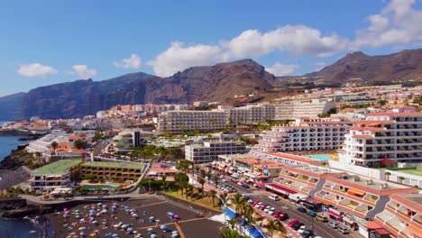 establishing aerial of la arena beach in santiago del teide, tenerife