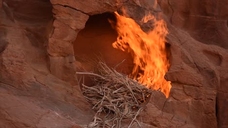 fire burning in a brown rock cavity, wadi rum, jordania