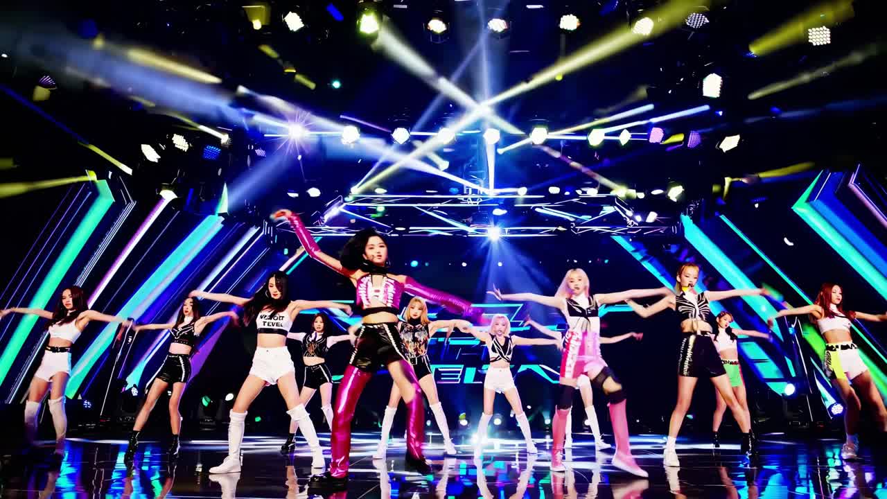 Energetic kpop girl group performing a synchronized dance routine on a vibrant, futuristic stage, captivating the audience with dynamic lighting and visual effects