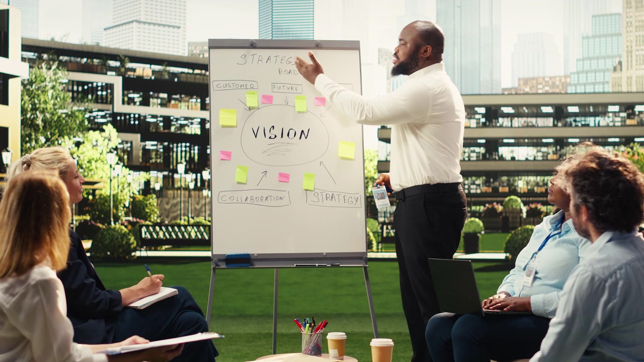 African american presenter pointing at vision board with sticky notes