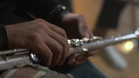 male hands hold a flute