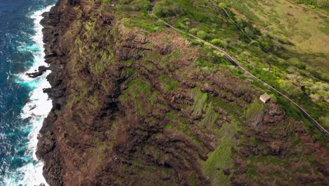 aerial shot revealing makapu'u lighthouse trail in oahu, hawaii