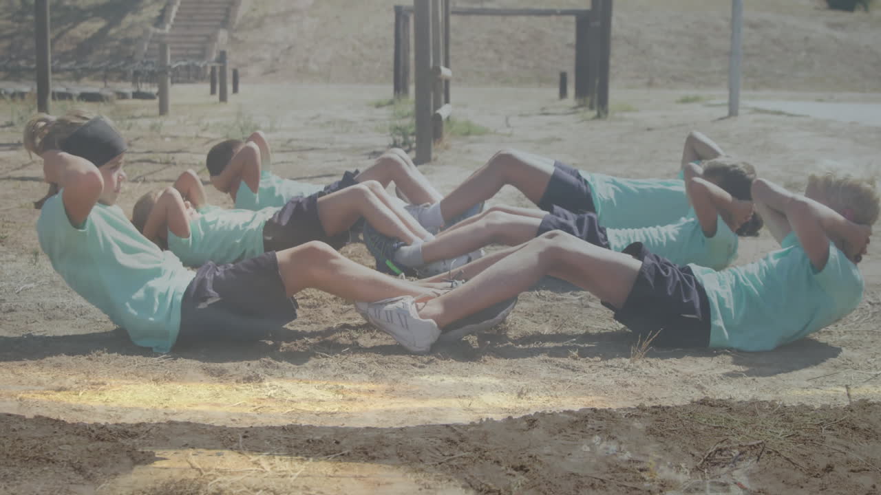 Athletes doing sit-ups outdoors on sunny day with animation in background