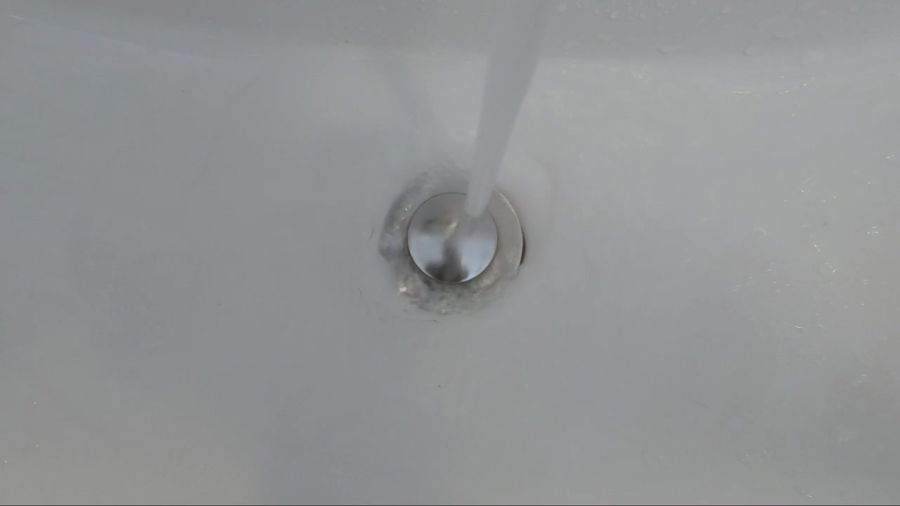 Fresh water flowing from tap.