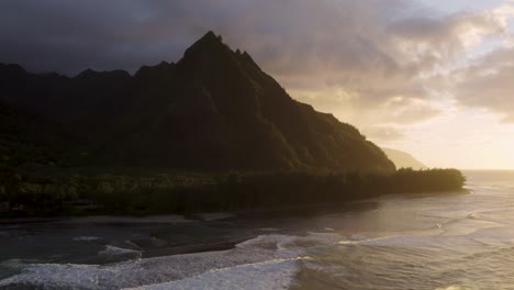 dramatic aerial footage of famous haena park, and kalalau trail by napali coast during sunset