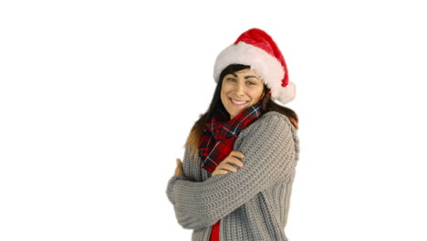 Woman-in-santa-hat-and-warm-clothing-blowing-over-hands-