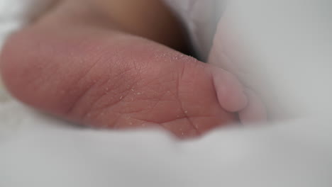 extreme close up of baby foot with dry skin