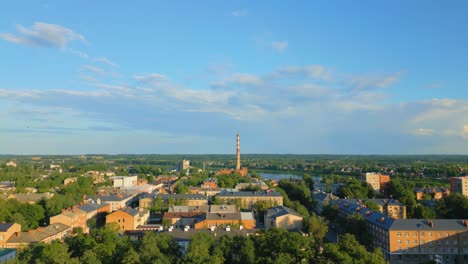 Aerial-view-of-the-city-of-Daugavpils-during-summer-on-the-banks-of-Daugava-River-at-sunset,-Latvia,-Aerial-View