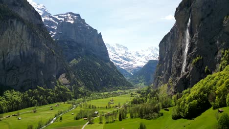 swiss alps valley with waterfall