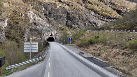 The-Ospeli-Tunnel-going-through-the-Ospeli-mountain-between-Hjelledalen-valley-and-Skjerdingsdalen-Valley-at-RV-15-in-Strynefjellet-mountain-Norway---Aerial-showing-tunnel-entrance