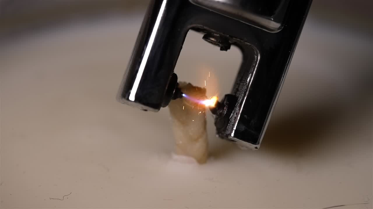 Failed Attempt to Light Candle Wick with Gas Lighter - Close Up
