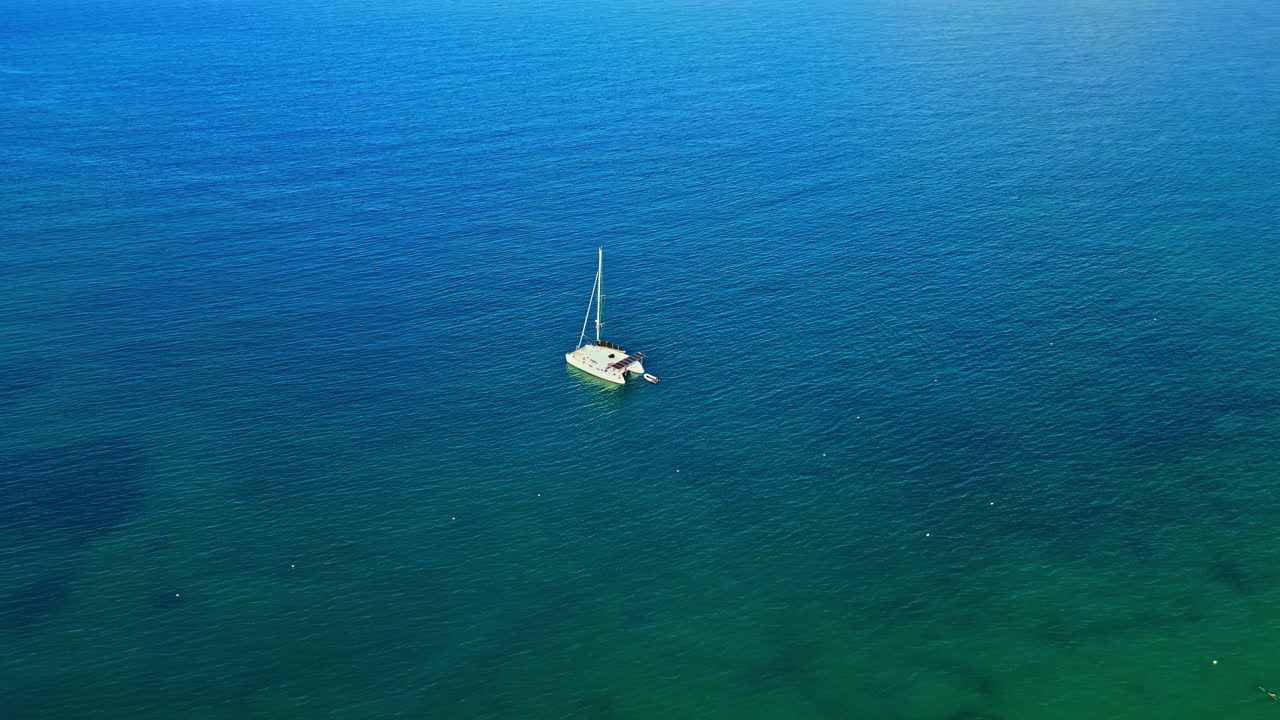 Catamaran boat turquoise green blue Mediterranean sea water sailing marine