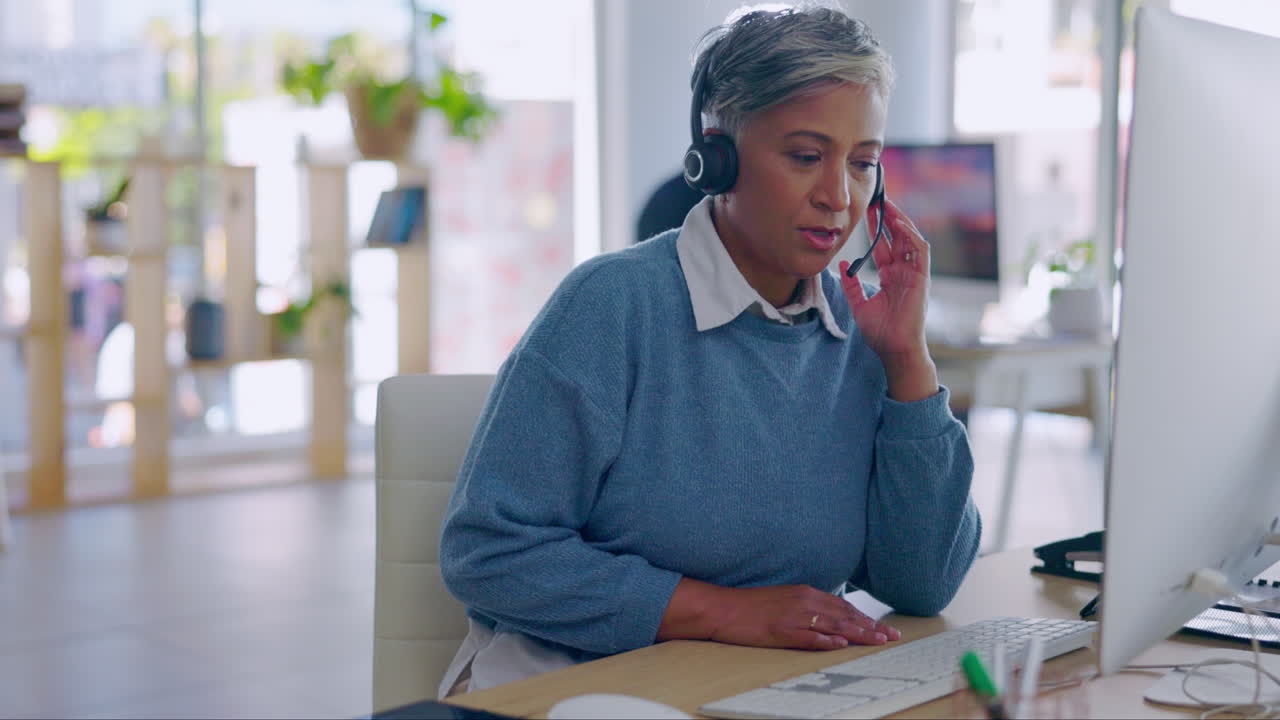 Senior woman, call center and typing with talking