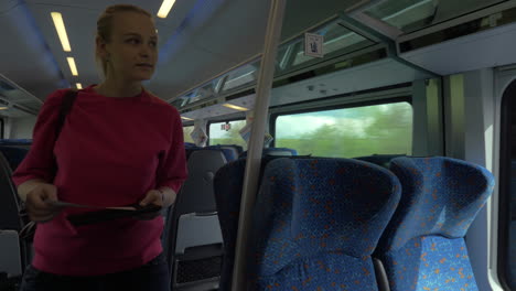 Woman-taking-her-seat-in-the-train