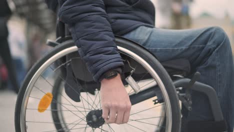 person with a physical disability waiting for city transport with an accessible ramp