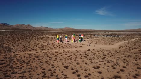 People-at-Seven-Magic-Mountains-in-Mojave-Desert,-Nevada,-USA