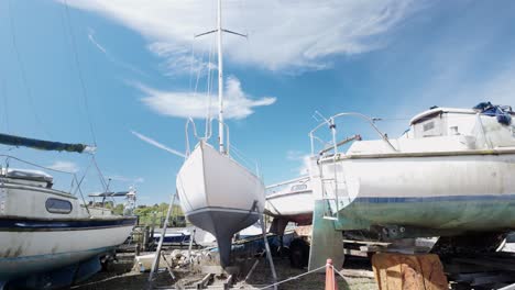 sailing boats in dry dock at quiet southwold marina boatyard river blyth