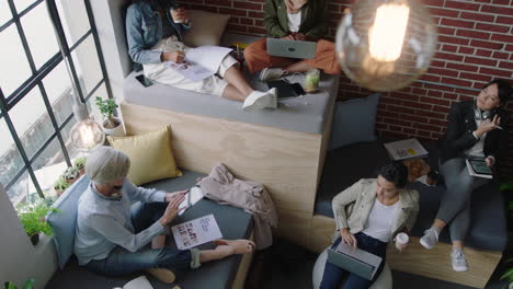 diverse business women brainstorming team discussing creative marketing strategy sharing ideas working on startup project together enjoying teamwork in relaxed modern office workplace top view