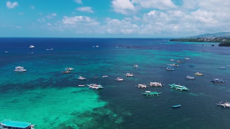 stunning aerial of boracay’s turquoise waters with boats over vibrant coral reefs. perfect for travel, tourism, tropical lifestyle, and ocean adventure projects