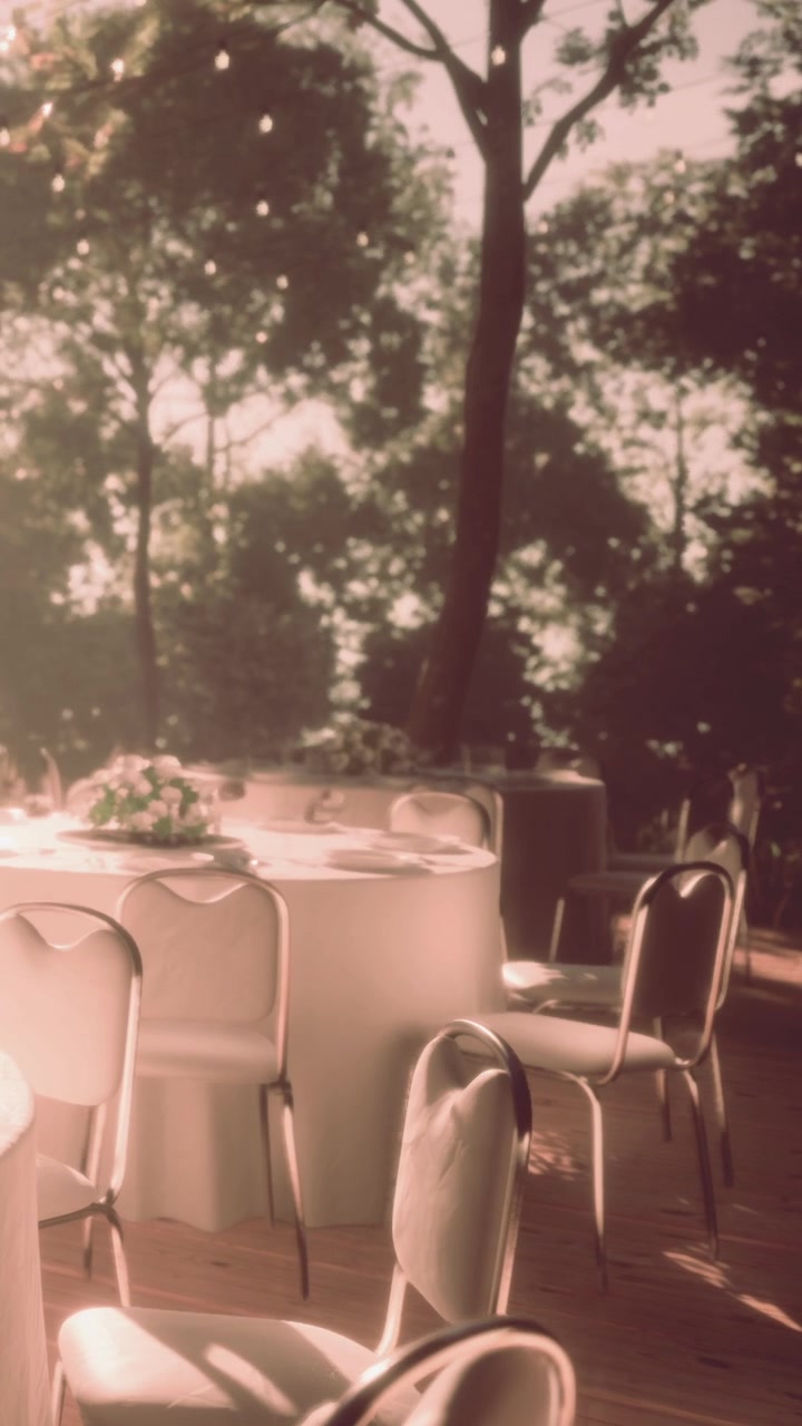 Outdoor event setup with tables and chairs in a garden area during the day