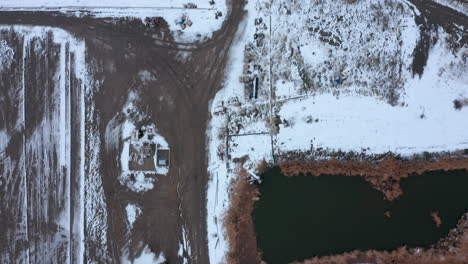 Top-Down-view-of-a-wintery,-snowy-farm-in-Tehachapi,-CA