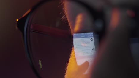 person looking at a social media post through glasses