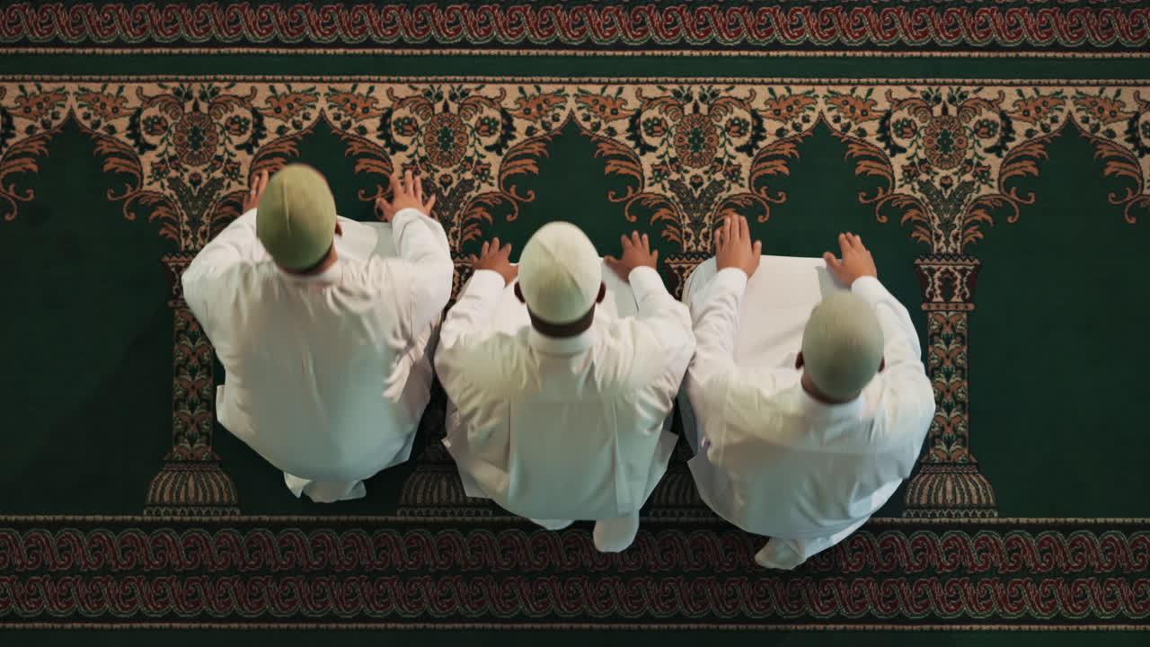 Muslim men praying in a mosque