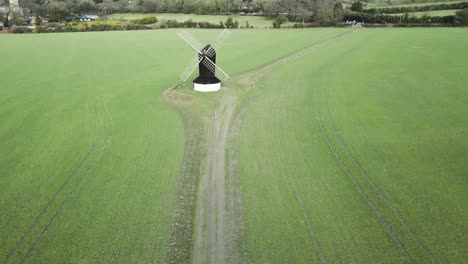 famous ancient pitstone windmill in buckinghamshire farmland field, uk - aerial