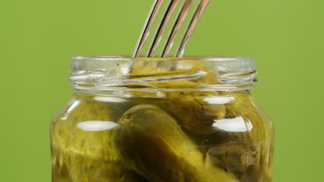 pickled cucumbers in a jar