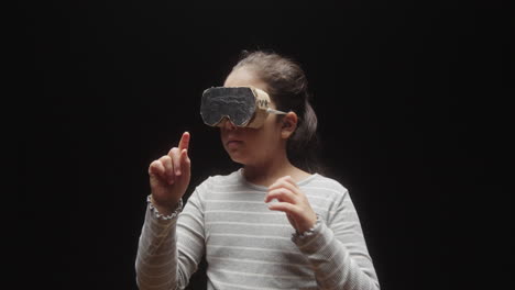 girl playing with diy cardboard vr headset