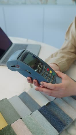 paying with a credit card at a point of sale terminal