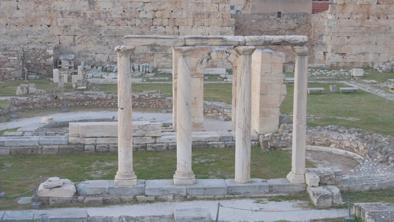 Ancient stone ruins and corinthian columns of Hadrian's Library in the historic center of Athens