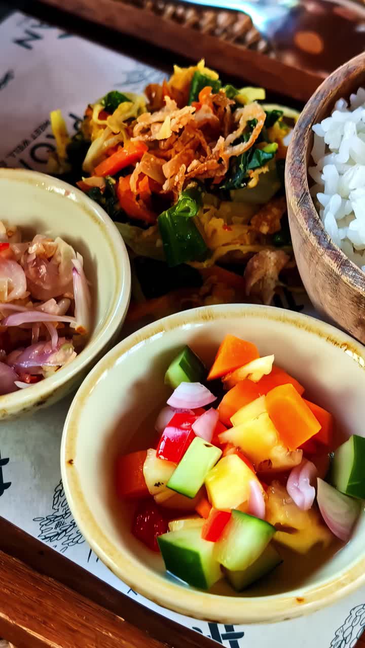 Balinese rice and vegetable bowls. Vertical close-up