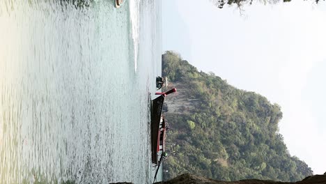 Thai-long-tail-boat-anchored-in-lagoon-of-island-in-Krabi,-Thailand