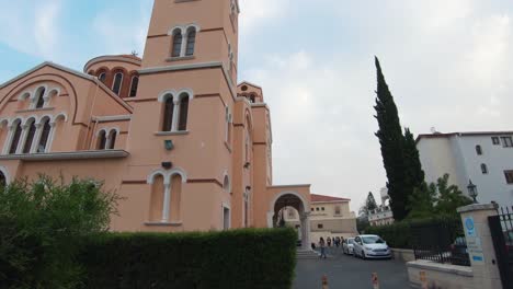 reveal of holy cathedral of virgin mary pantanassis in limassol, cyprus - wide slide left to right reveal shot