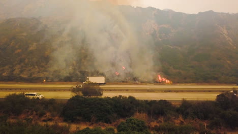 aerial of firefighters battling the huge thomas fire in ventura county along the 101 freeway 1