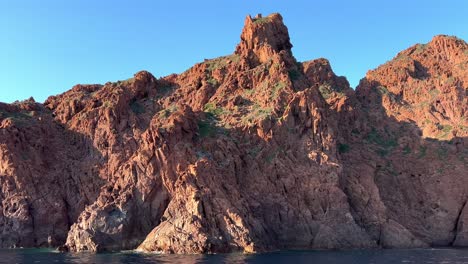 Trip-to-Scandola-peninsula-nature-reserve-in-summer-season-as-seen-from-moving-boat,-Corsica-island-in-France