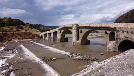 ancient stone bridge at the city of kalabaka near meteora in greece