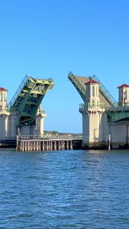 intercoastal ocean drawbridge closing after sailboat goes under, sunny blue sky