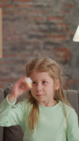 little girl shakes bottle with golden paint sitting with elder sister in living room slow motion. family art hobbies. supplies for artistic work